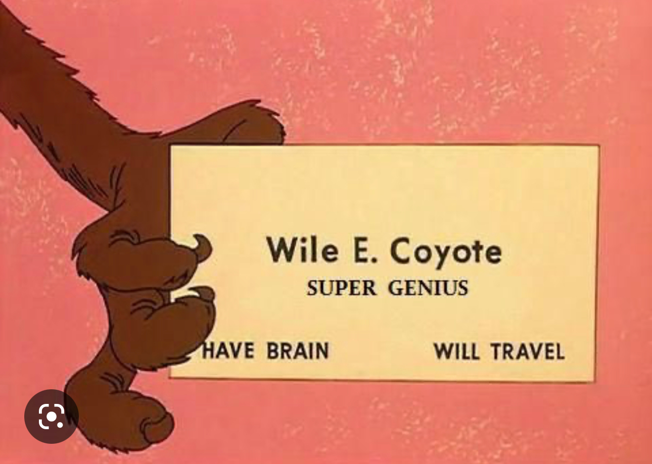 Still from a Coyote / Road Runner cartoon. The Coyote holds a business card saying Wile E. Coyote Super Genius